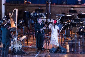 Paula Monsalve singer songwriter performing at the Marion Philharmonic Orchestra in Marion, Indiana from Linares Chile